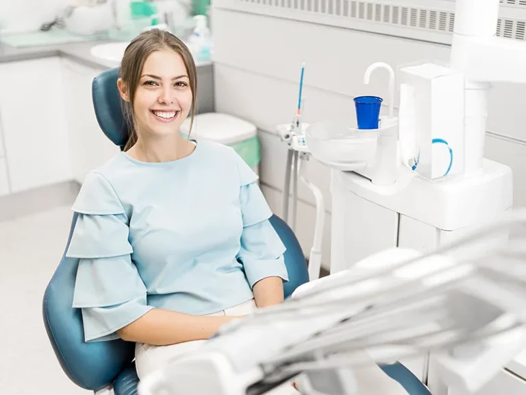 Dental Cleaning 2 Young woman smiling confidently in a dental chair after professional Bellingham dental care.