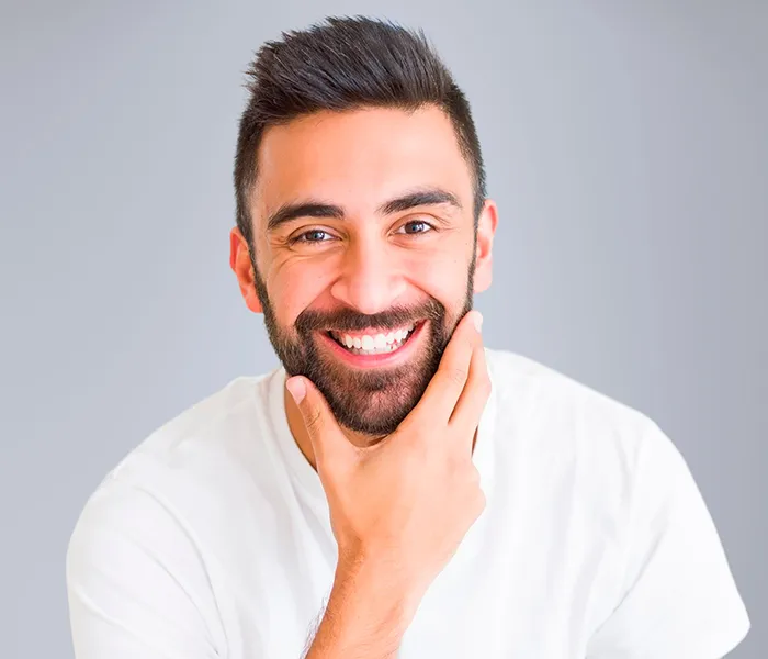 Single Implants 1 Single Dental Implants - Smiling man after care at a trusted family dentist in Bellingham.