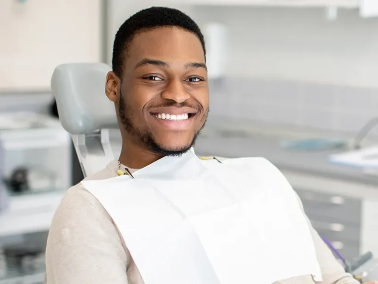 Whitening 4 Happy patient smiling after visit with cosmetic dentist in Bellingham at Roots Dental.