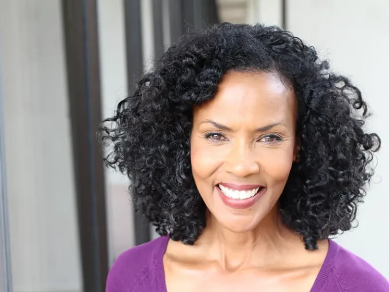 All-on-Implants 3 Confident woman smiling after professional dental care at a Bellingham dentist office.