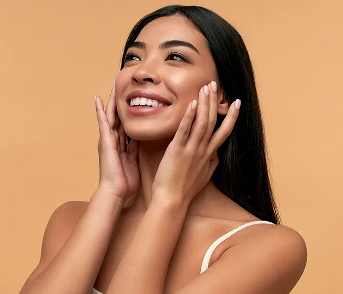 Facial Injections 1 Facial Injections - Smiling woman showing healthy teeth after visit with local dentist in Bellingham at Roots Dental.
