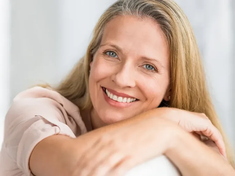 Facial Injections 3 Mature woman smiling confidently after treatment with a cosmetic dentist in Bellingham at Roots Dental.