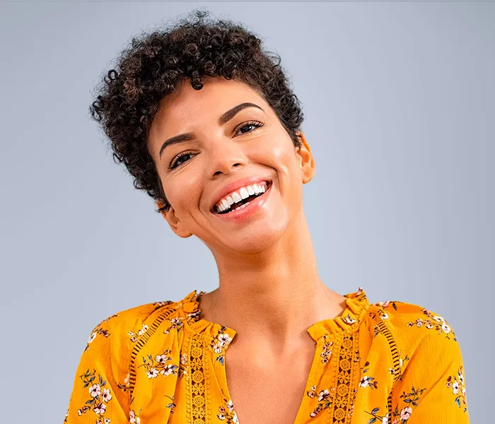 Whitening 1 Whitening - Smiling woman with bright teeth highlighting results from a cosmetic dentist in Bellingham.