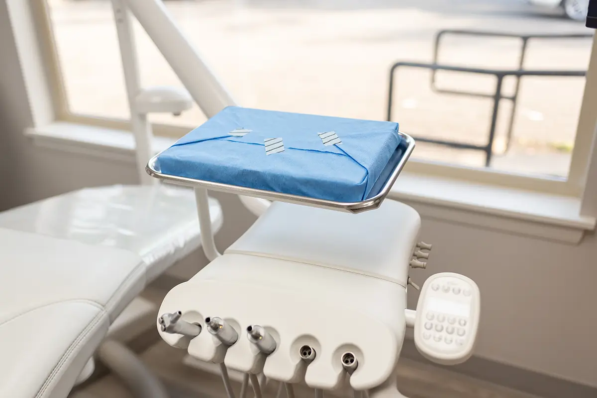 Safety and Comfort 2 Sterilized dental instrument tray wrapped in blue protective covering at Roots Dental in Bellingham.