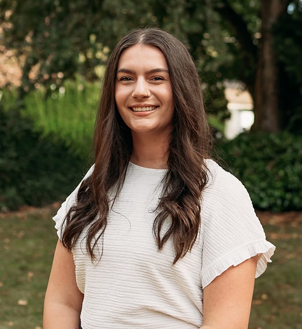 Meet the Doctor 8 Female Roots Dental team member in Bellingham smiling outdoors, focused on patient care.