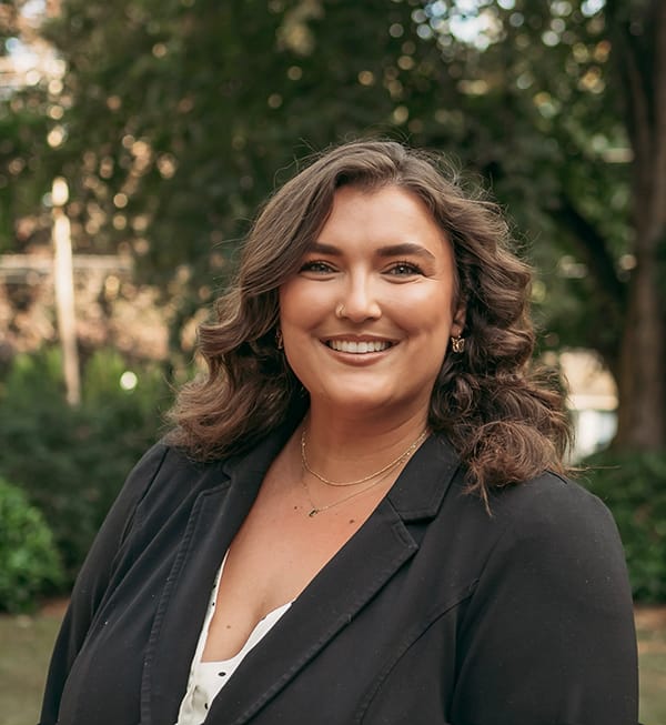 Meet the Doctor 3 Female Roots Dental team member in Bellingham smiling outdoors, supporting quality dental care.