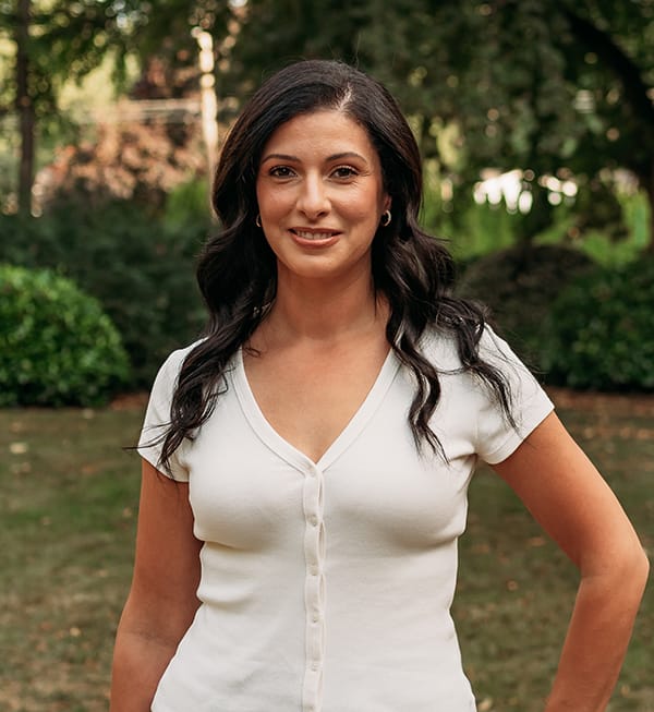 Meet the Doctor 10 Female Roots Dental team member in Bellingham smiling outdoors, dedicated to patient-focused dental care.