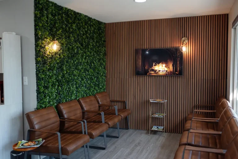 Invisalign 18 Modern and welcoming dental reception area at Roots Dental in Bellingham with comfortable seating and fireplace.