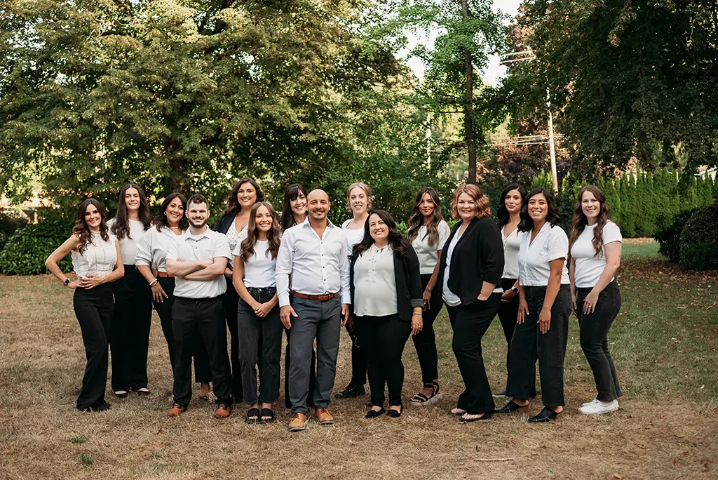 Your First Visit 3 About Roots Dental | Caring Dentist in Bellingham, WA - Roots Dental team in Bellingham standing together outdoors, dedicated to patient care and dentistry.