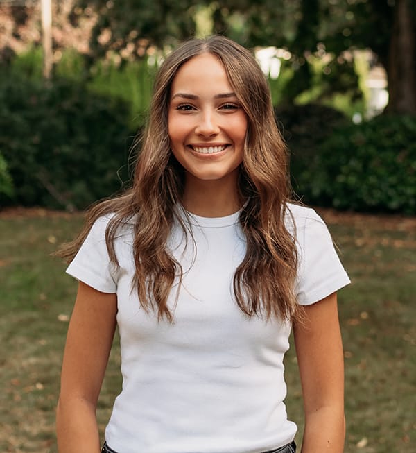 Meet the Doctor 11 Female Roots Dental team member in Bellingham smiling outdoors.