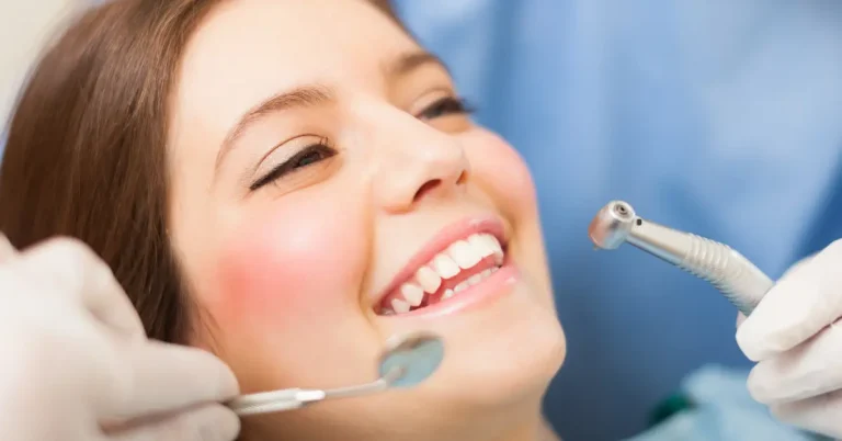 Smiling woman receiving a routine dental exam, representing non-urgent dental care and preventive dentistry.